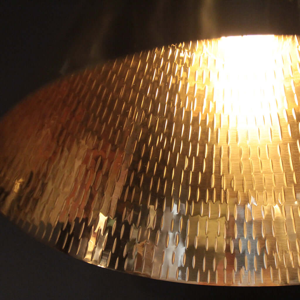 Gold textured lampshade with a light source inside