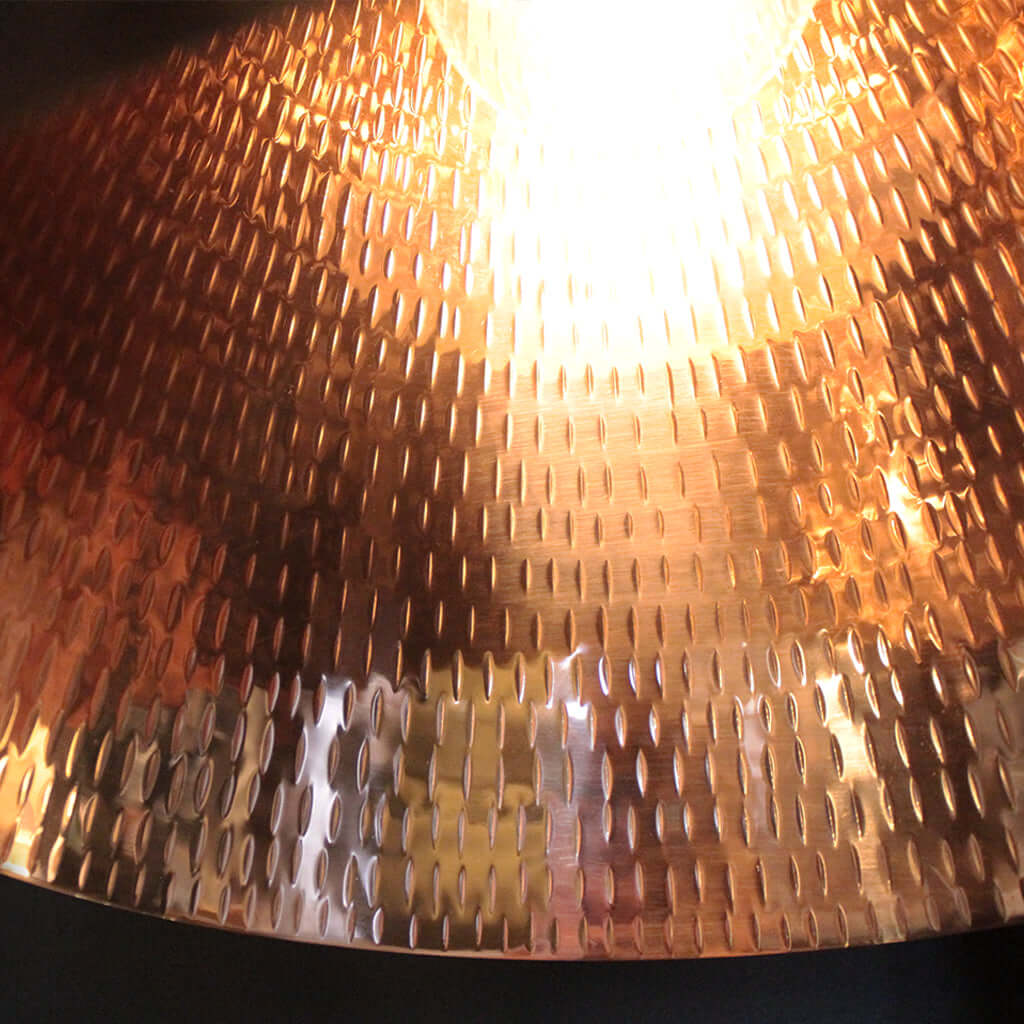 Close-up of a textured copper lampshade