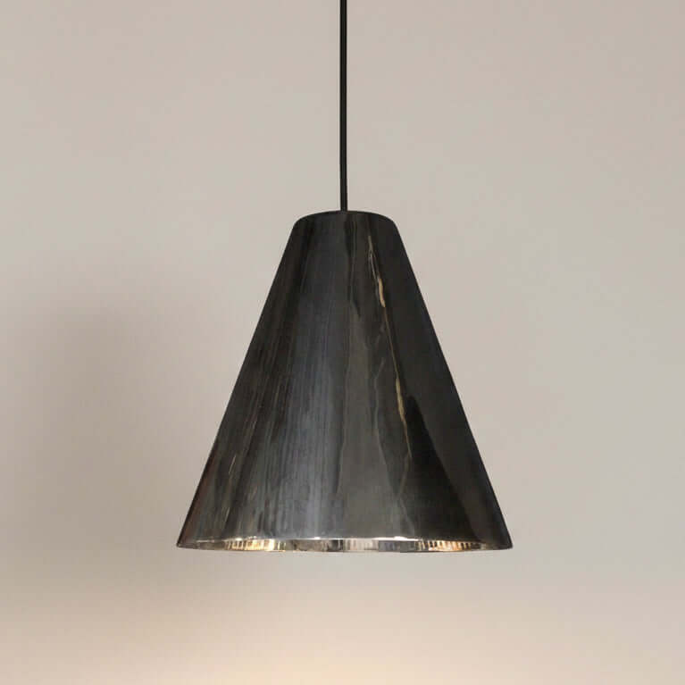 Silver pendant light on a white background