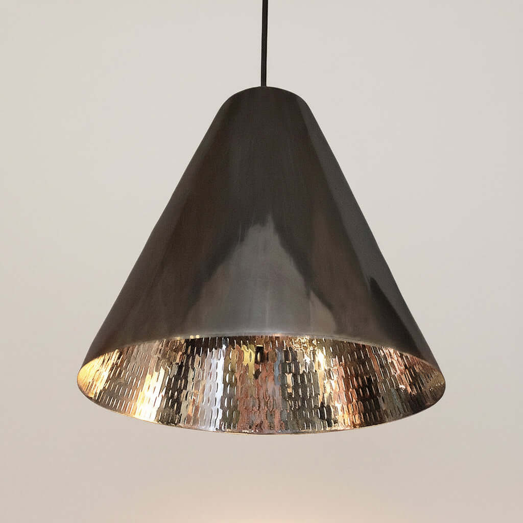 Conical pendant light with metallic finish on a white background