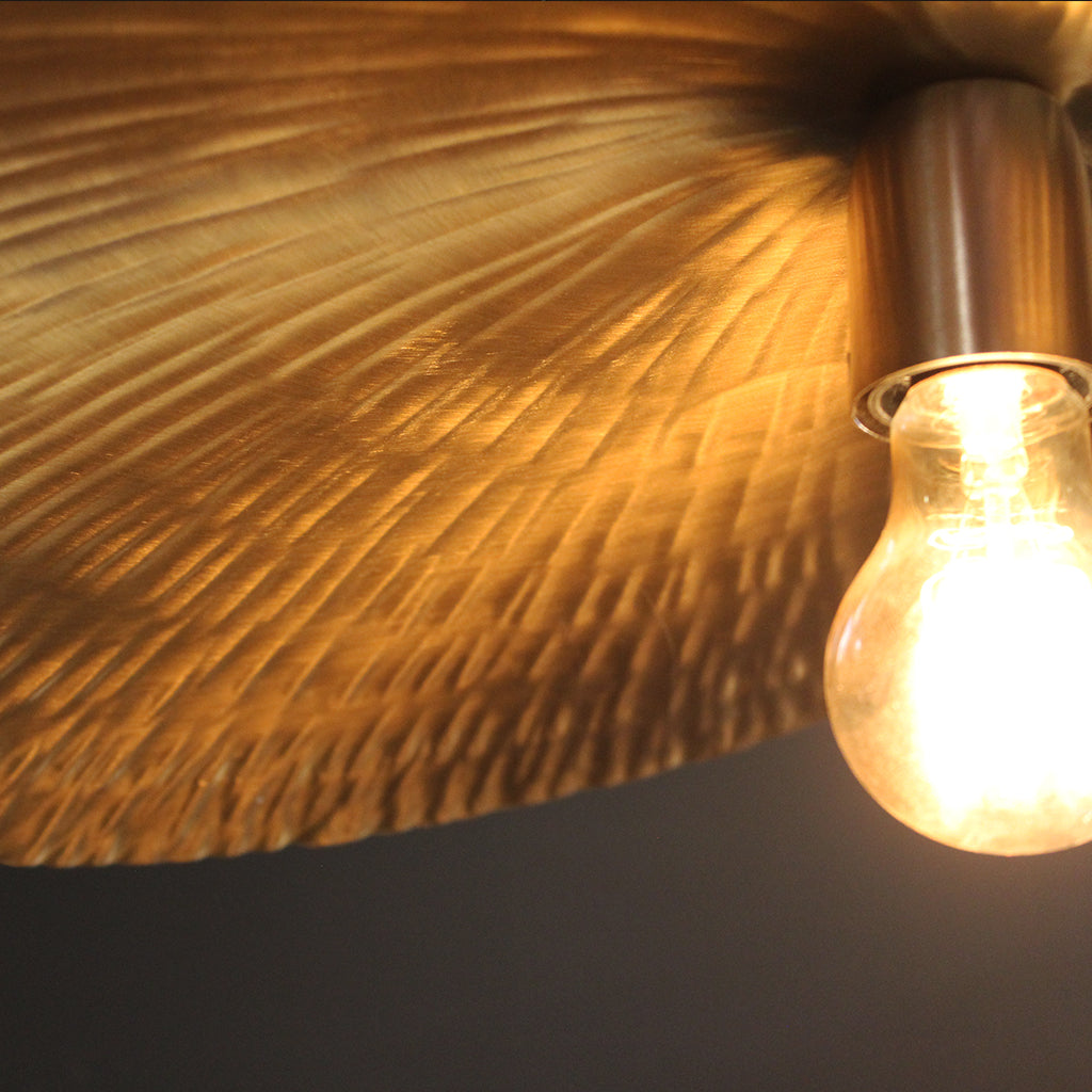 Handbeaten brass pendant detail