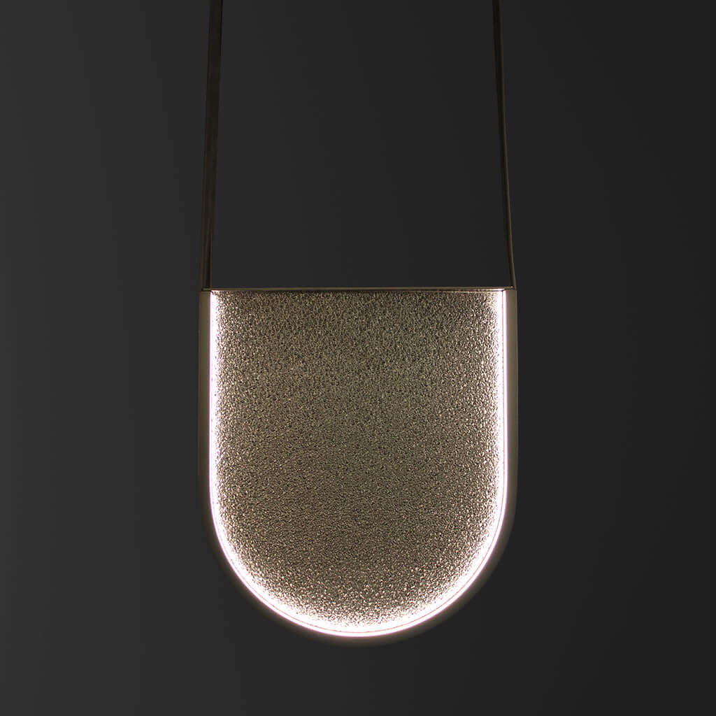 Metal and glass pendant light on a black background