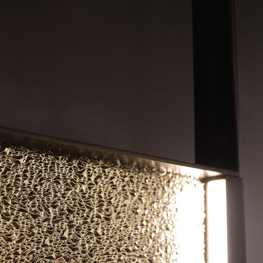 Close-up of a textured glass surface with light shining through