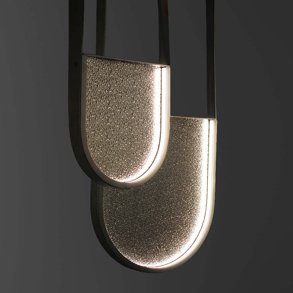 Modern pendant light with a textured shade on a dark background