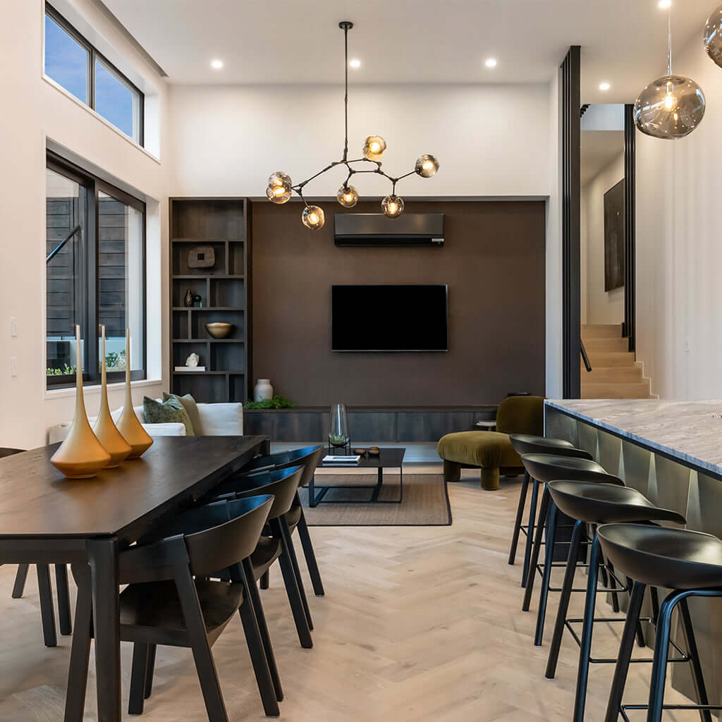 Modern living room with a dining table, chairs, and a bar area.