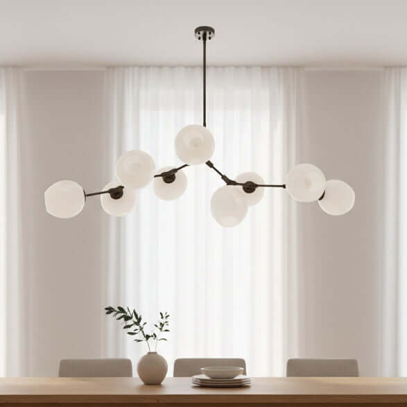 Modern chandelier with multiple round glass shades on a white background