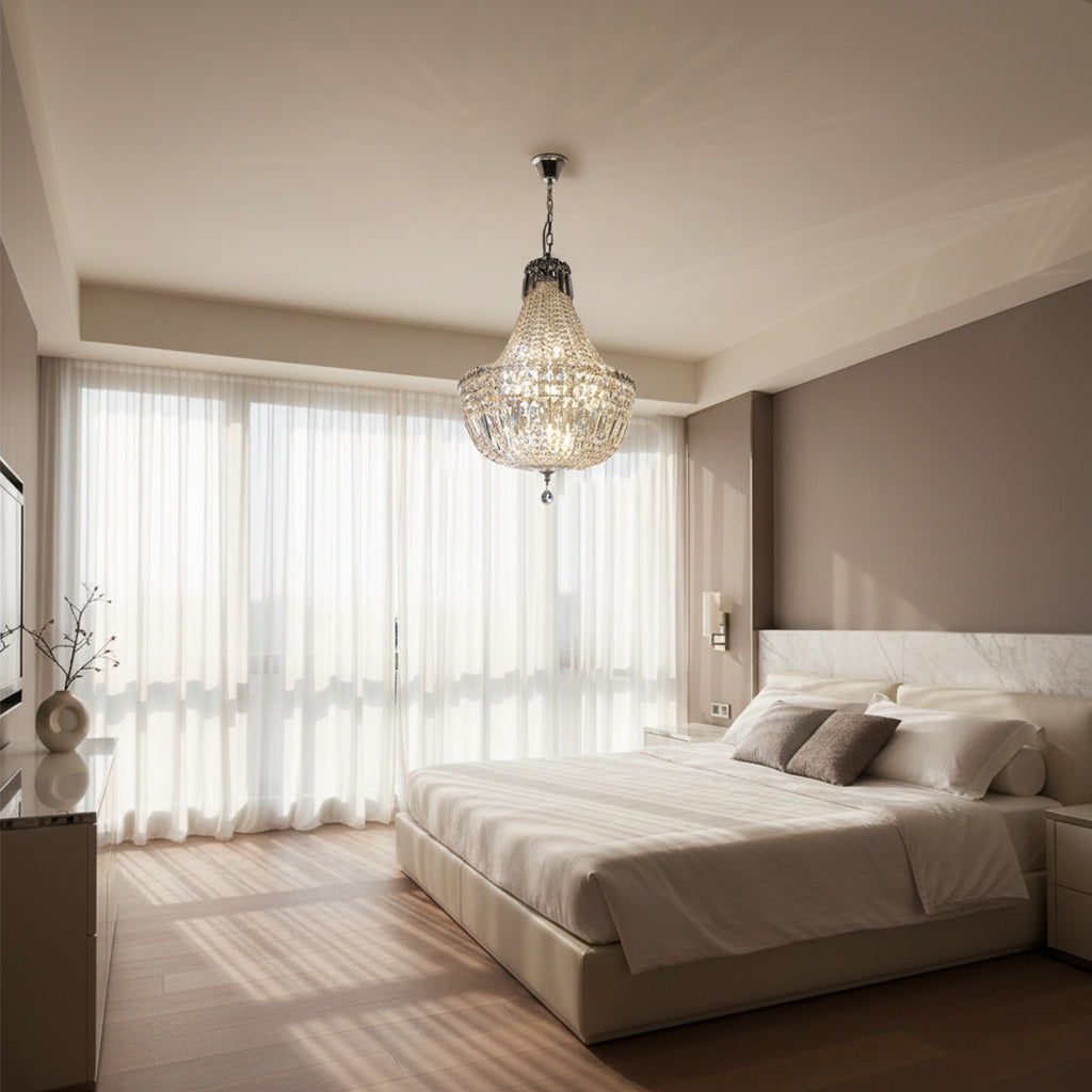 Modern bedroom with a chandelier, bed, and large window.