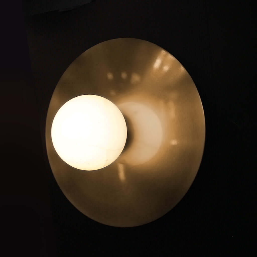 Brass round wall light with alabaster marble stone globe