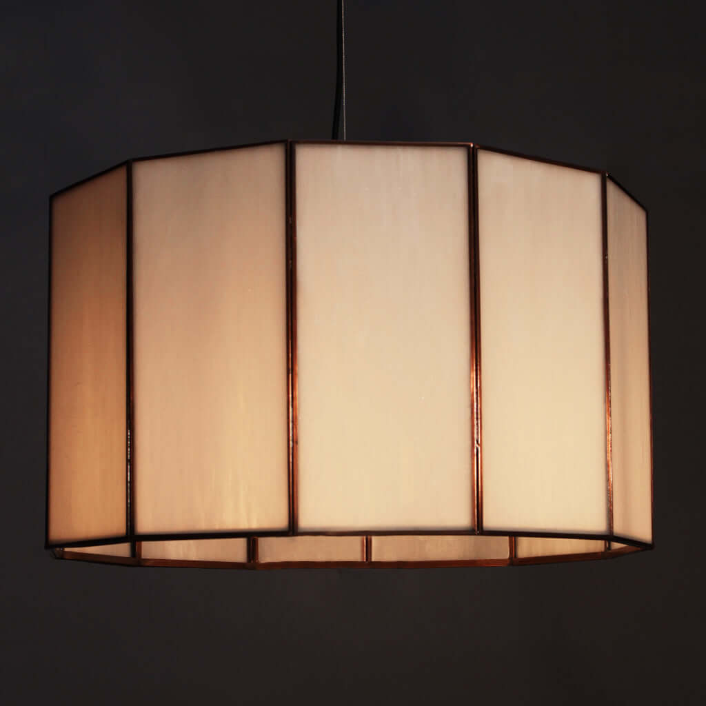 White glass lampshade with a dark frame on a black background