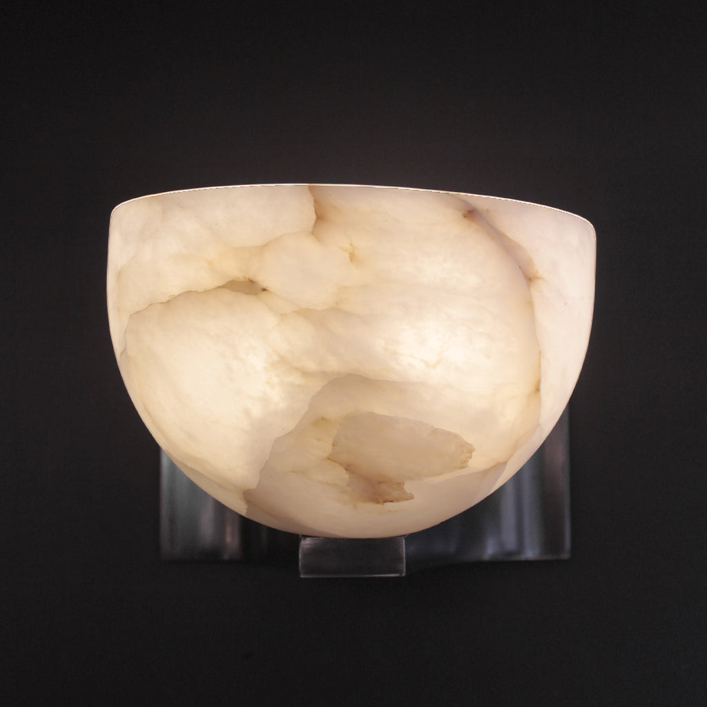 Marble-textured wall sconce on a black background
