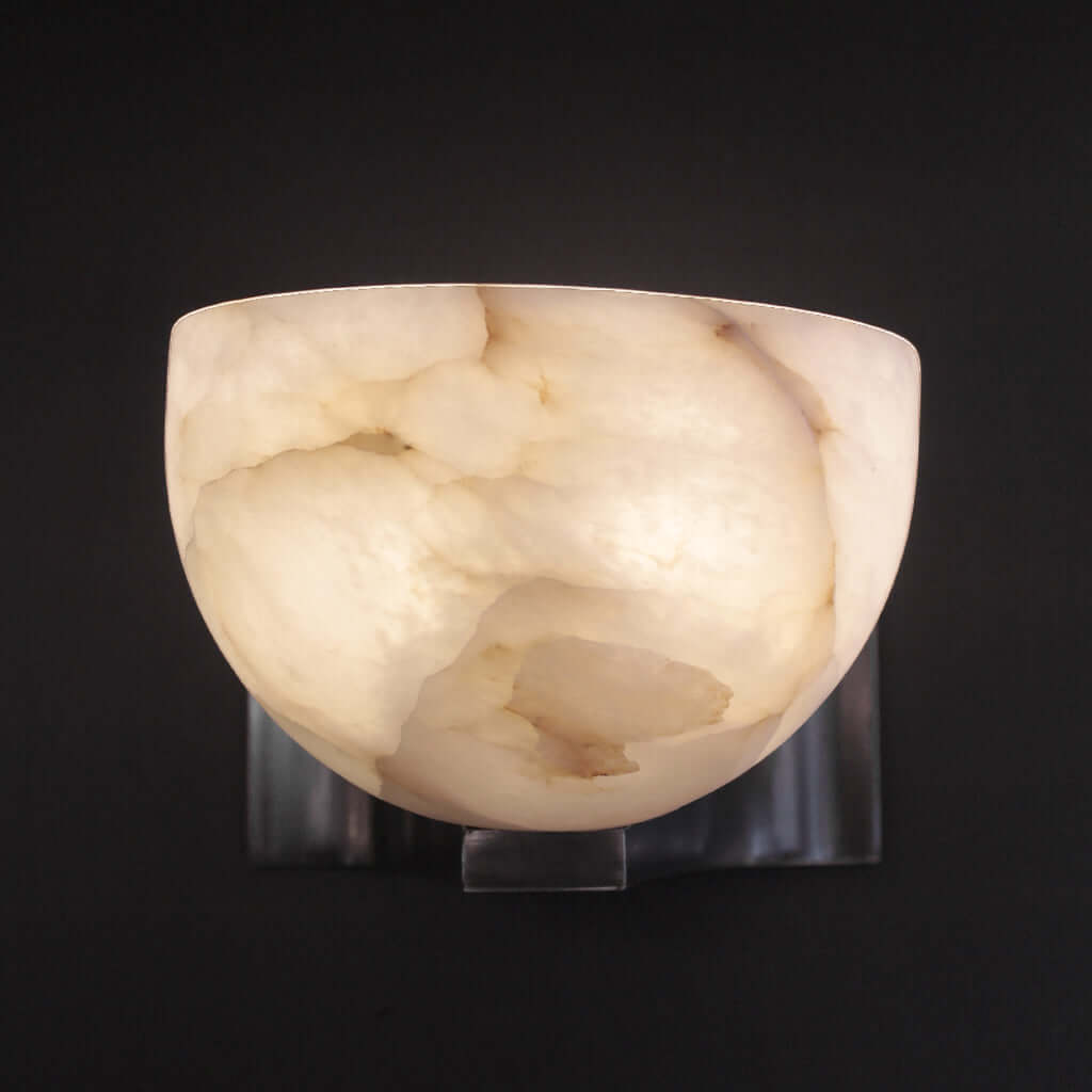 Marble-textured wall sconce on a black background
