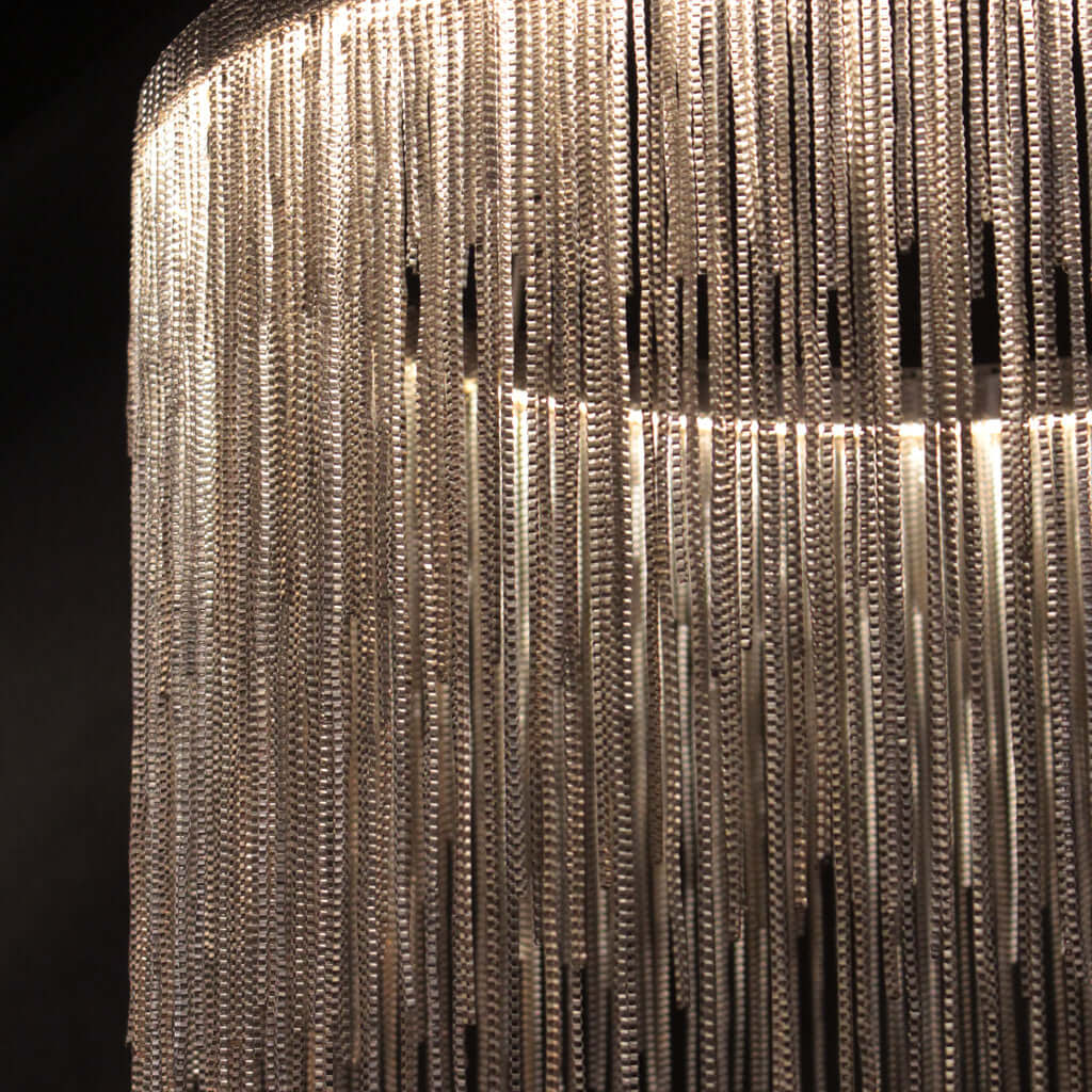 Chandelier with metal strands on a black background