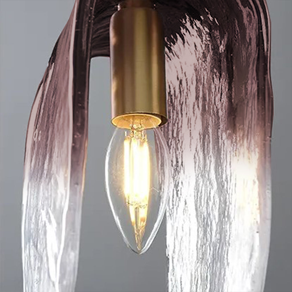 Light bulb inside a decorative lamp with a textured glass shade on a gray background