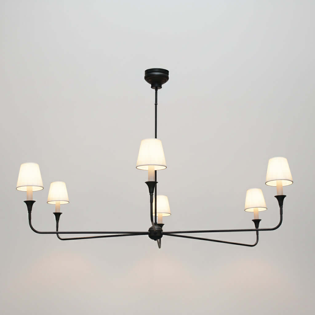 Modern chandelier with multiple light bulbs on a gray background