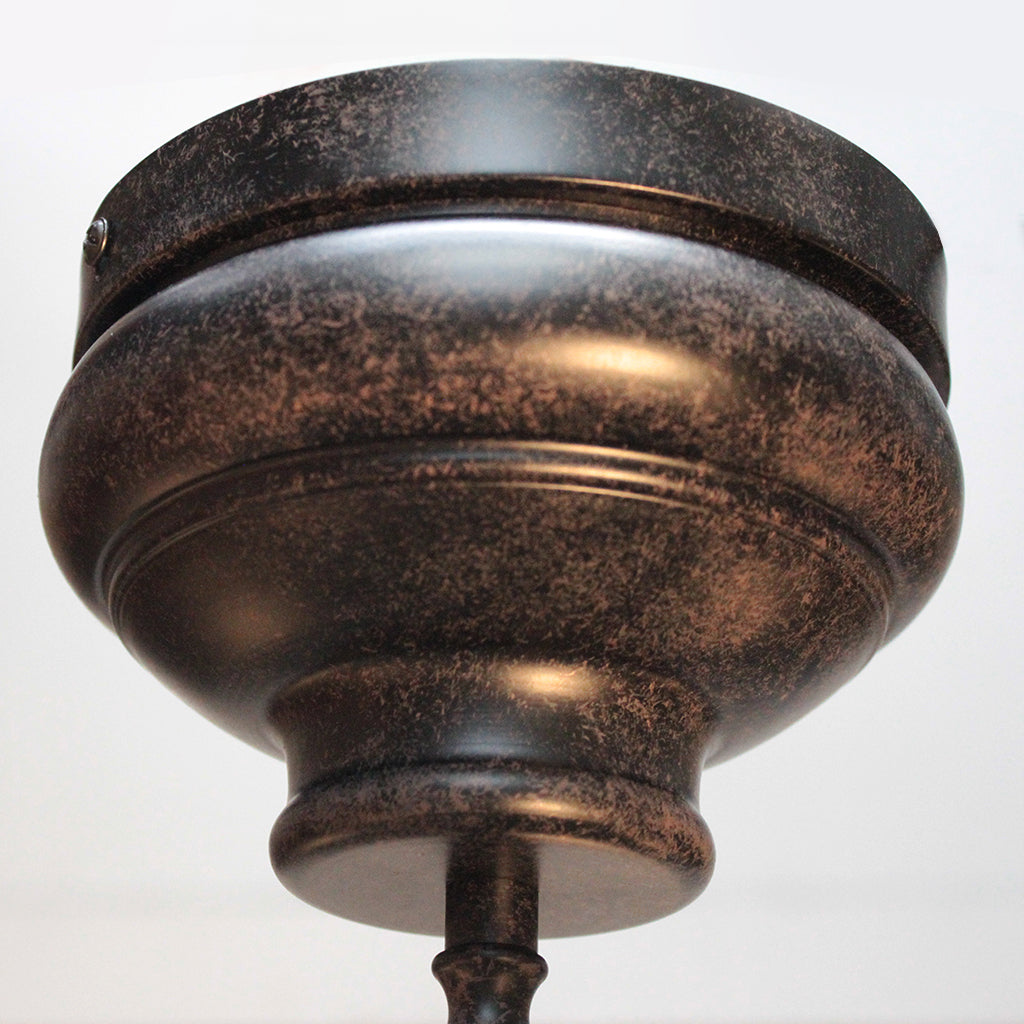 Bronze-colored ceiling medallion on a white background