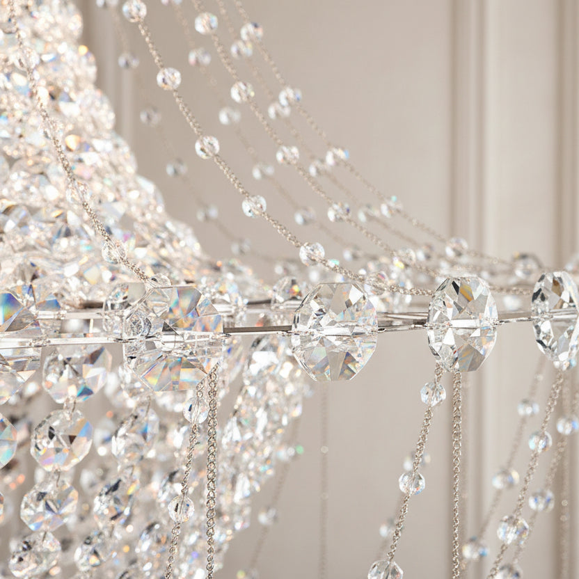 Crystal chandelier hanging against a plain wall