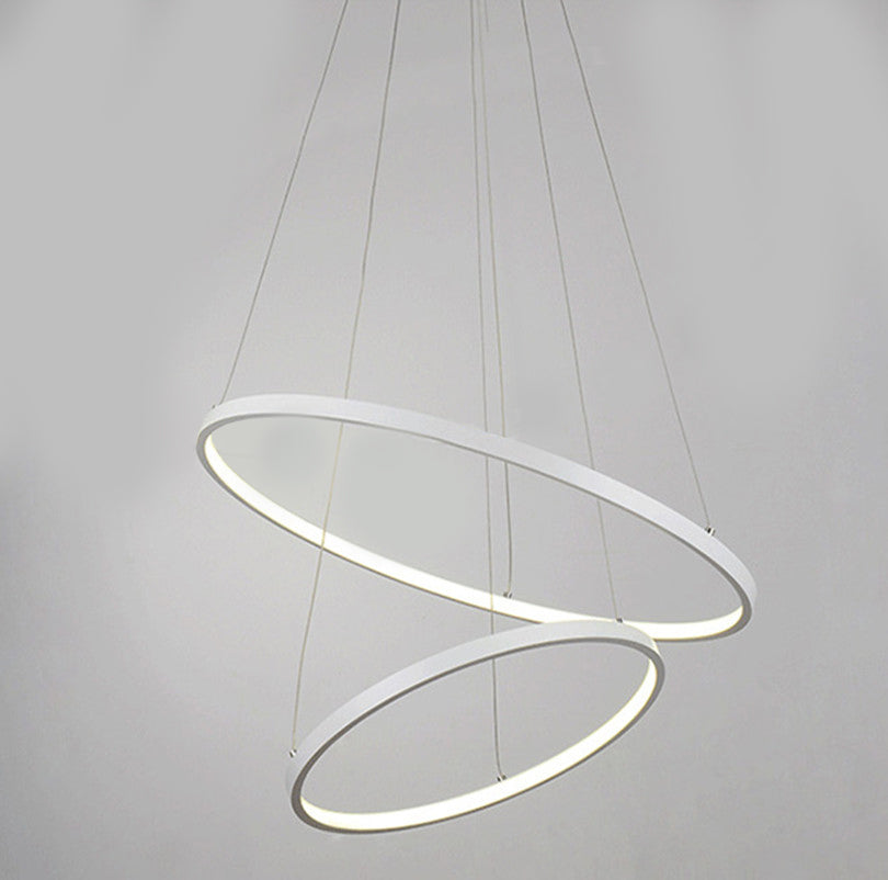 Modern pendant light with two concentric circular rings on a gray background