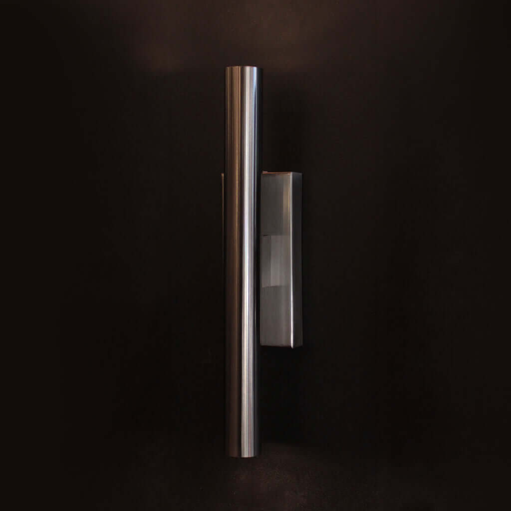 Three wall lights in varying finishes