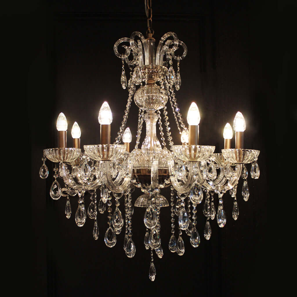 Crystal chandelier with multiple lights on a black background