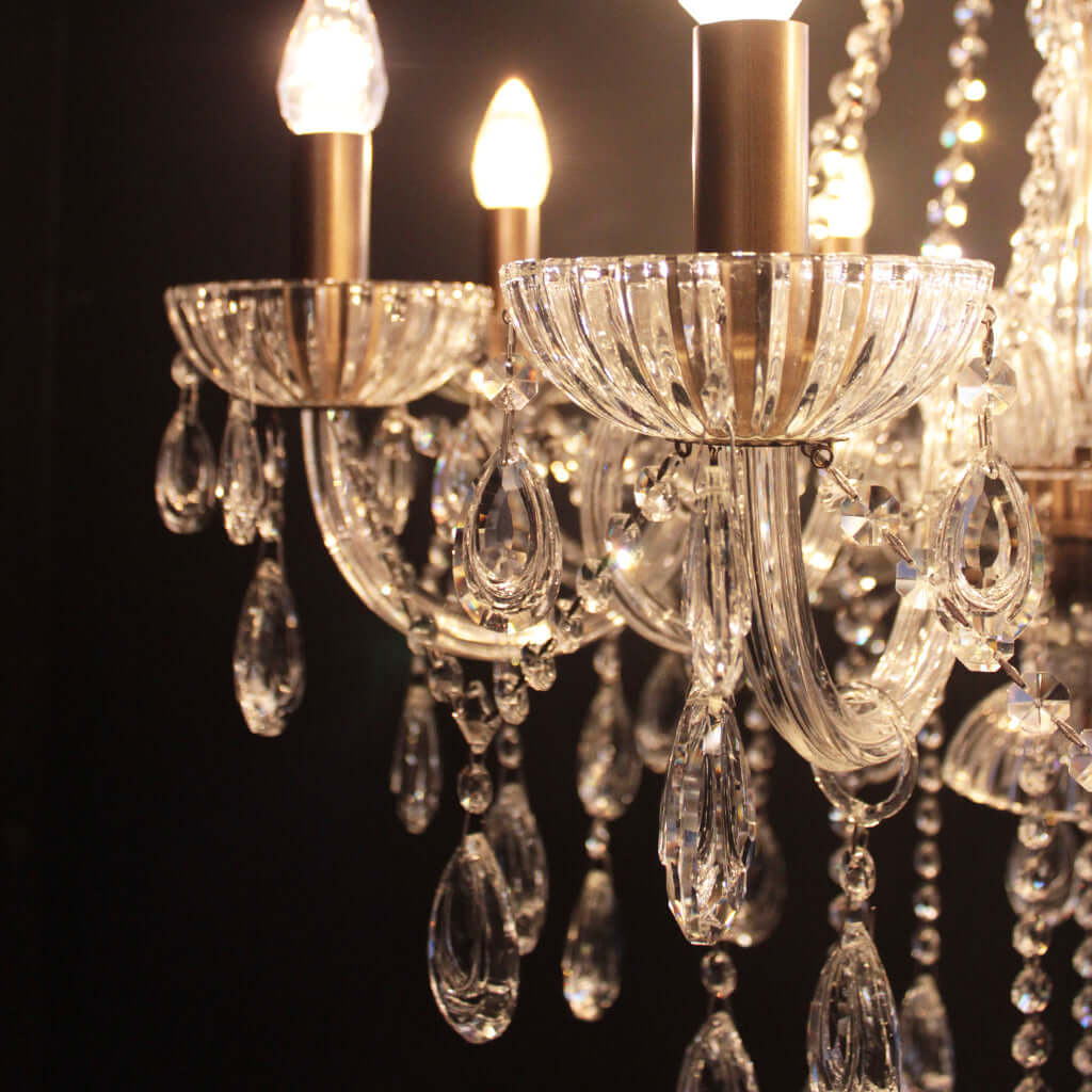 Crystal chandelier with multiple lights on a black background