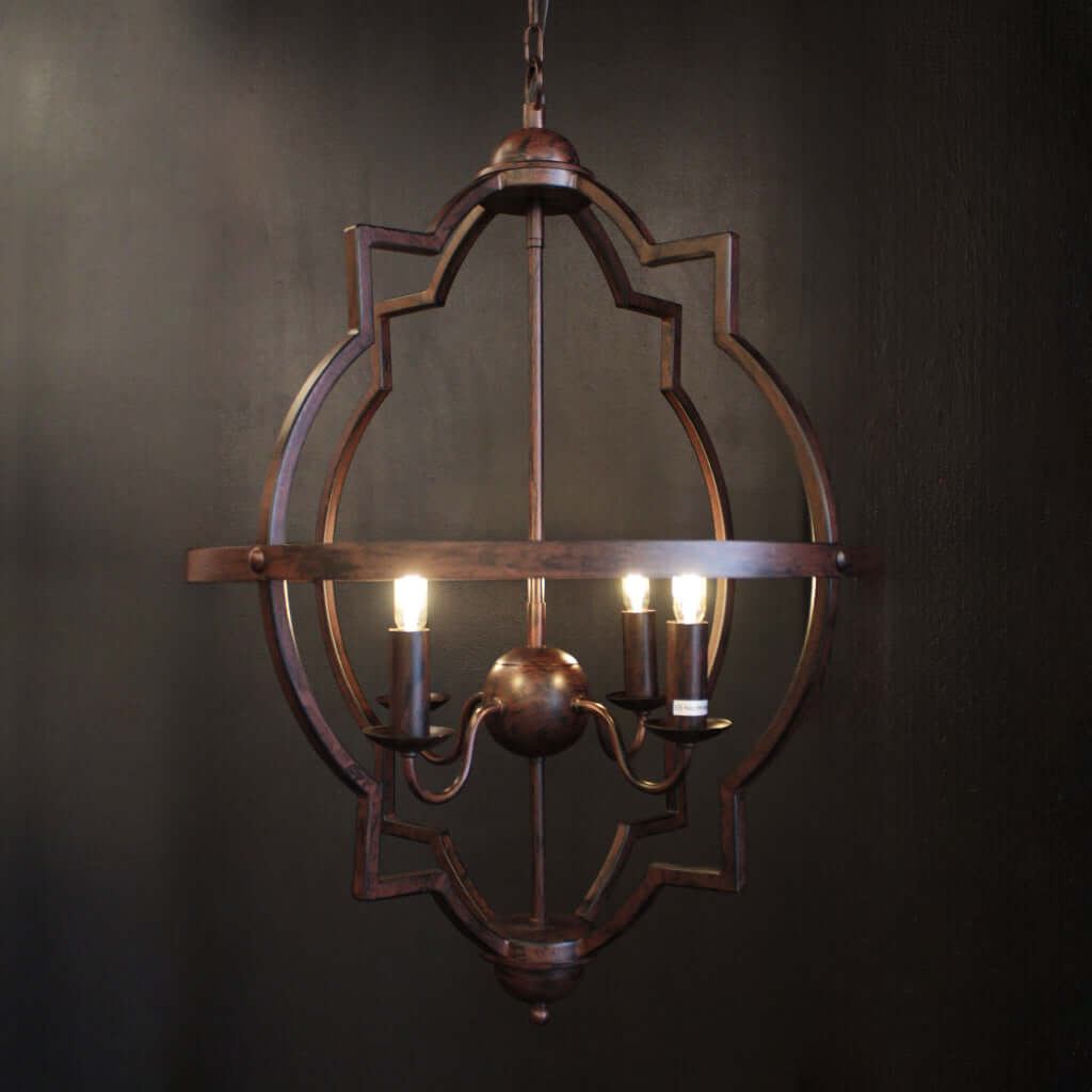 Decorative chandelier with three lights on a dark background