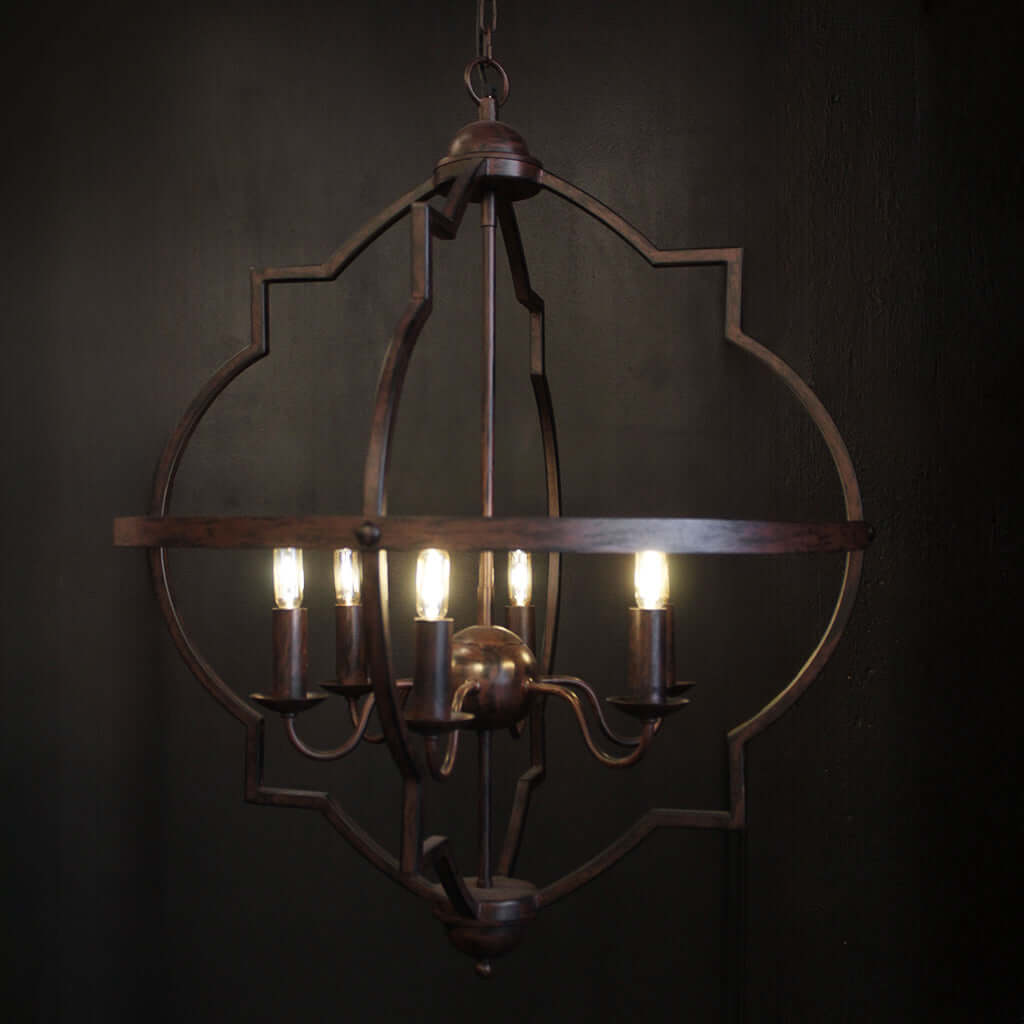 Decorative chandelier with four lights on a dark background