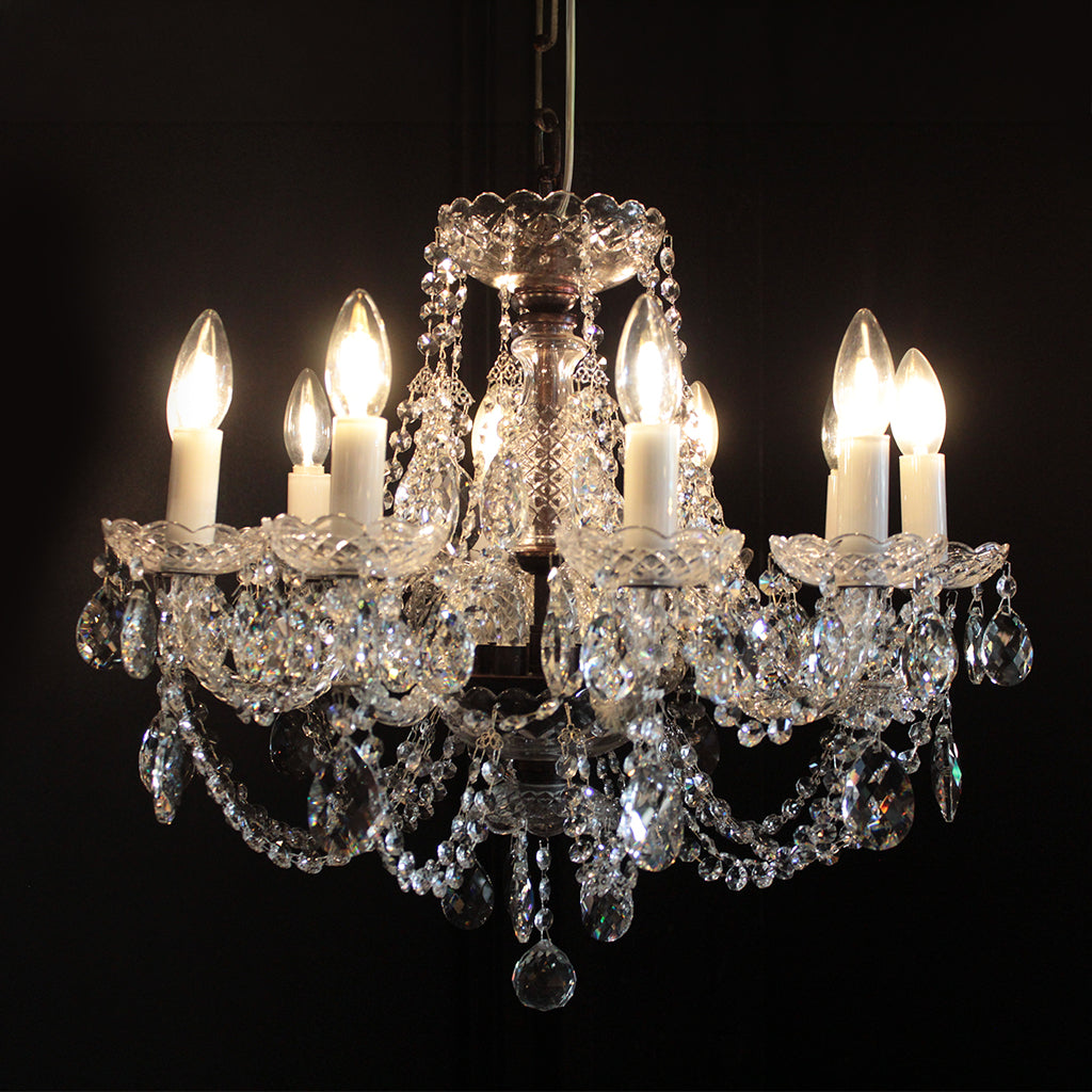 Crystal chandelier with eight light bulbs