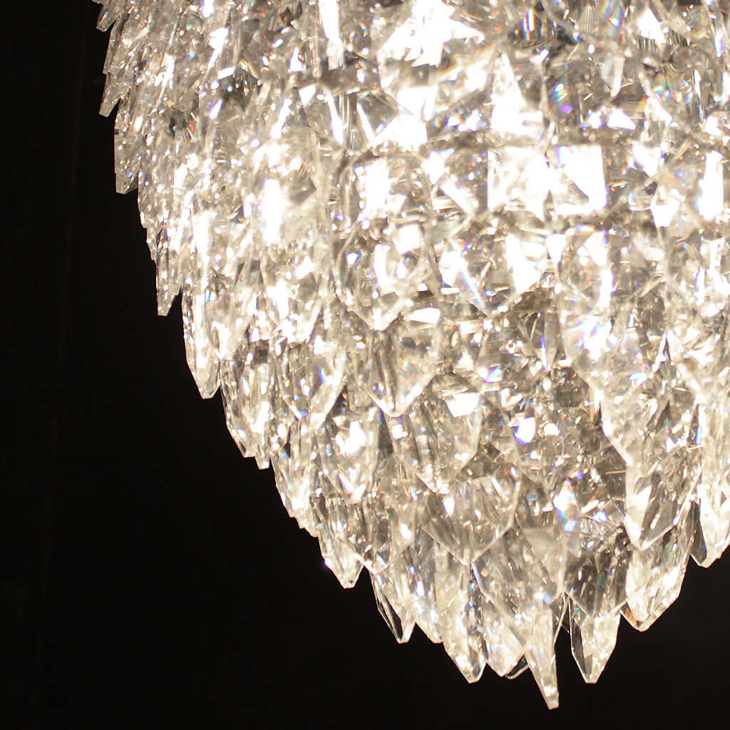 Close-up of a crystal chandelier against a black background