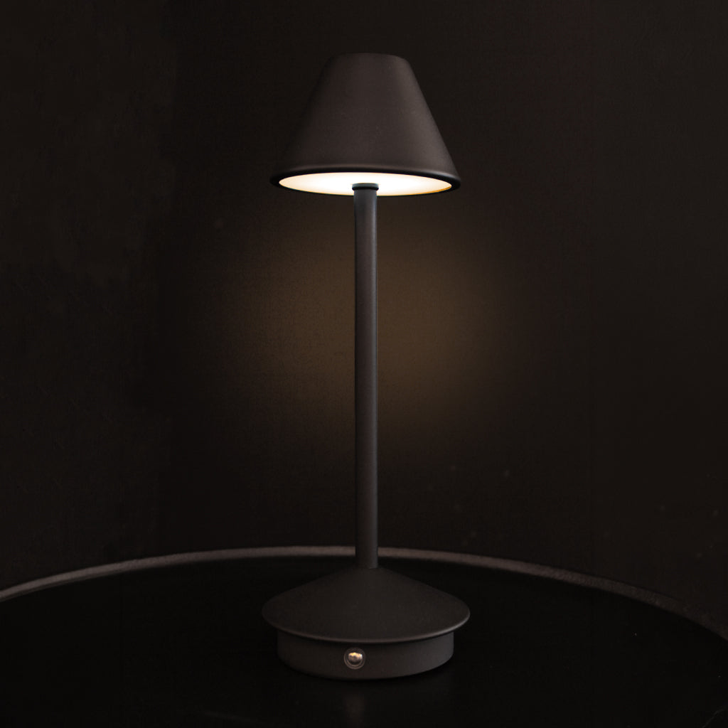 Matt black rechargeable portable table lamp with tapering shade and base