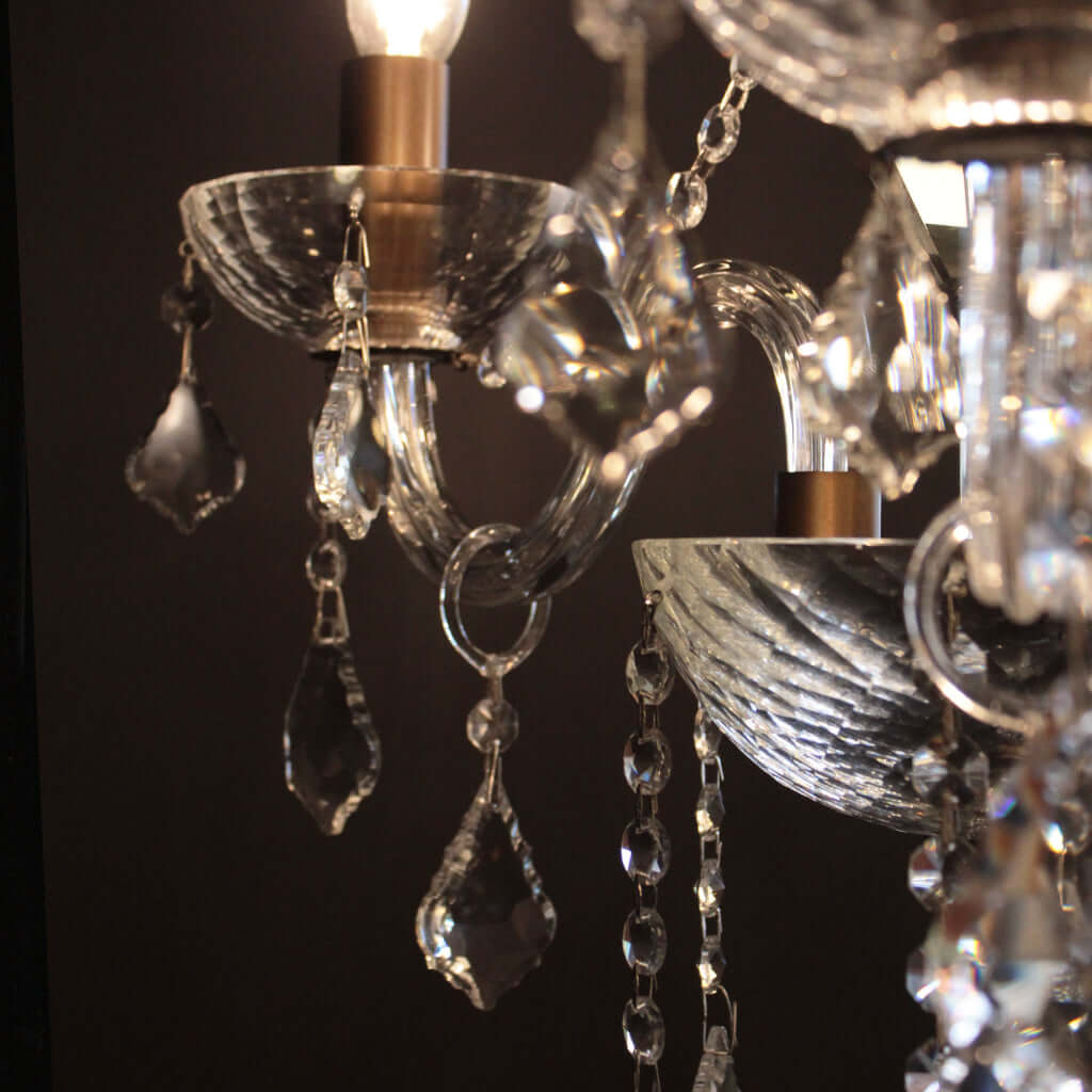 Close-up of a chandelier with crystal elements against a dark background
