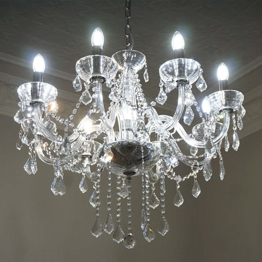 Crystal chandelier with multiple lights on a ceiling