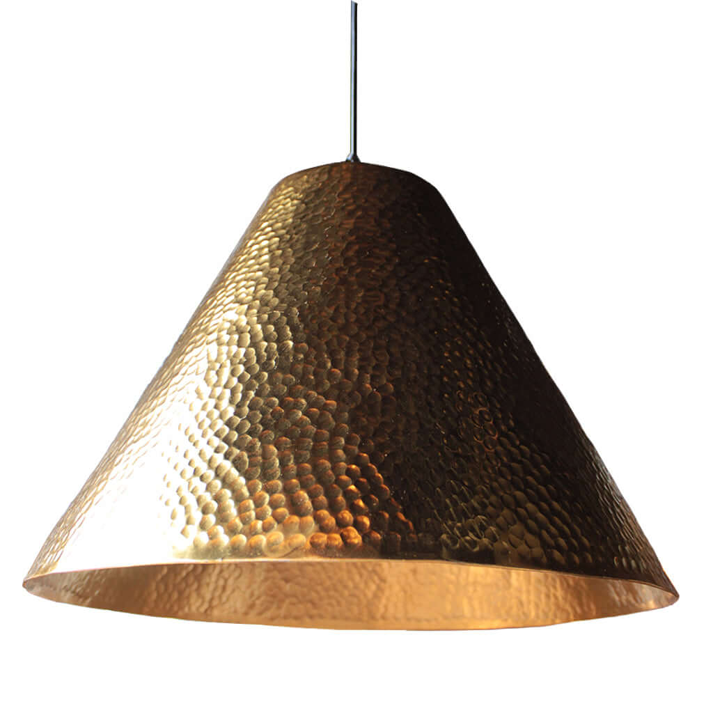 Hammered gold pendant light on a white background