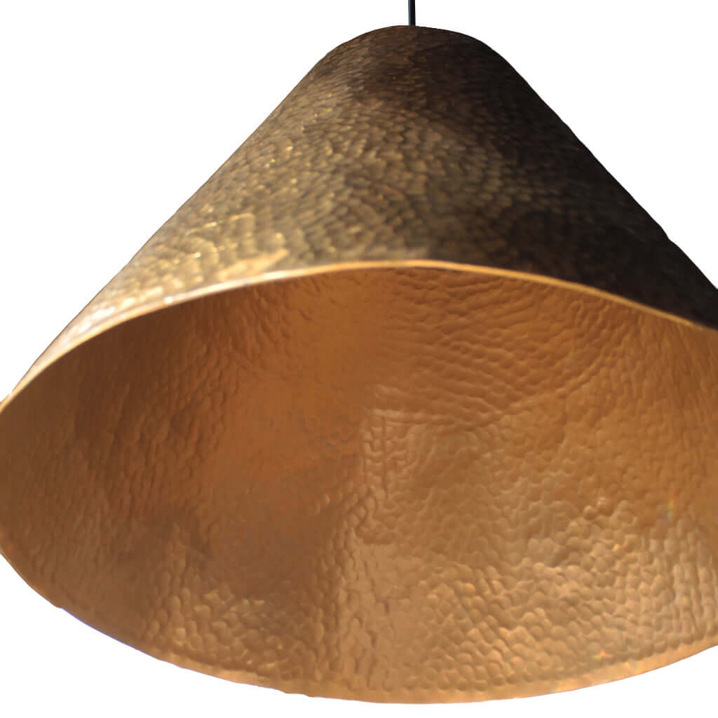 Textured gold pendant light on a white background