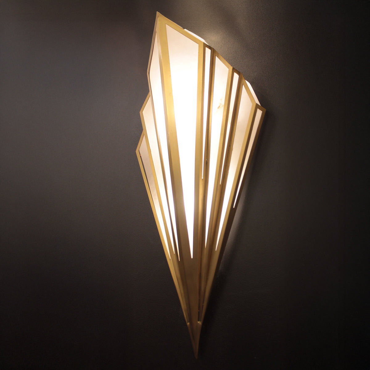 Decorative wall light fixture on a dark background