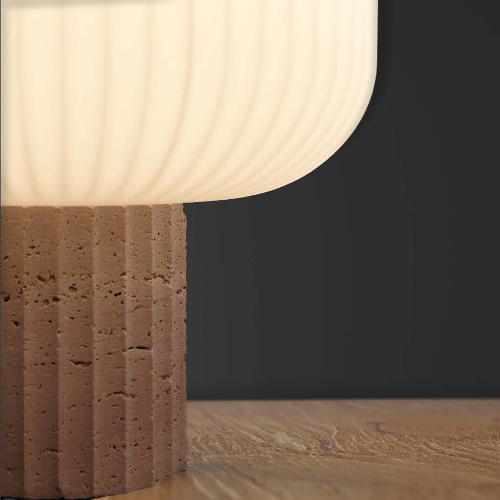 Lamp with a textured base on a dark background