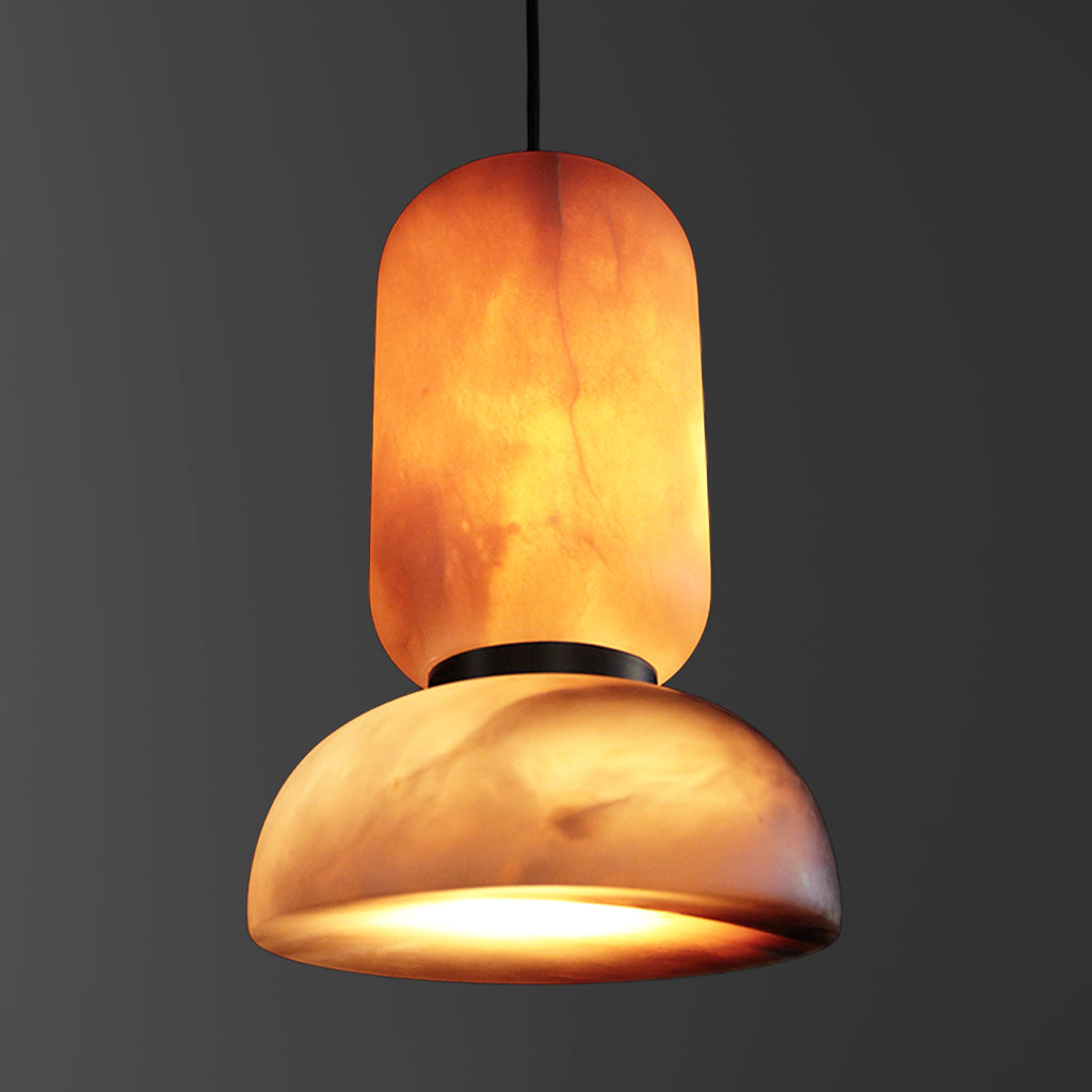 Pendant light with a warm, orange-brown stone shade on a dark background