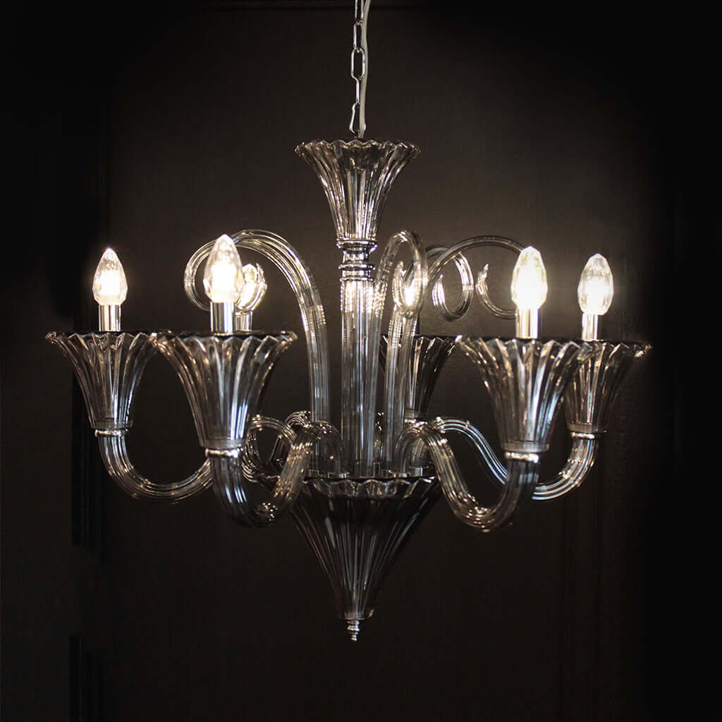 Smoke Grey crystal chandelier with six lights on a black background