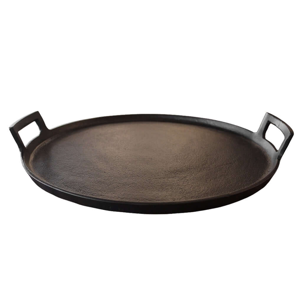Round black tray with handles on a white background
