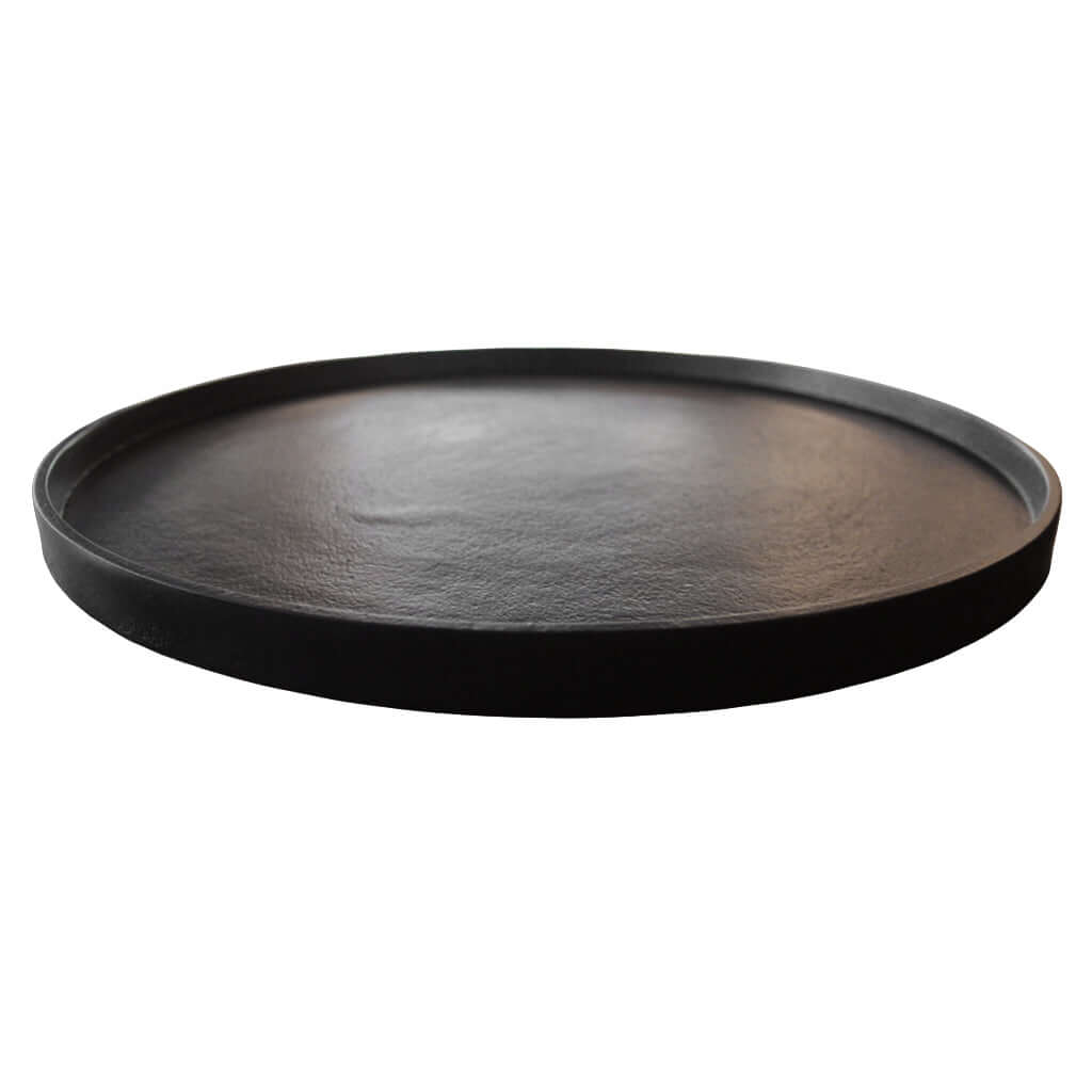 Round black tray on a white background
