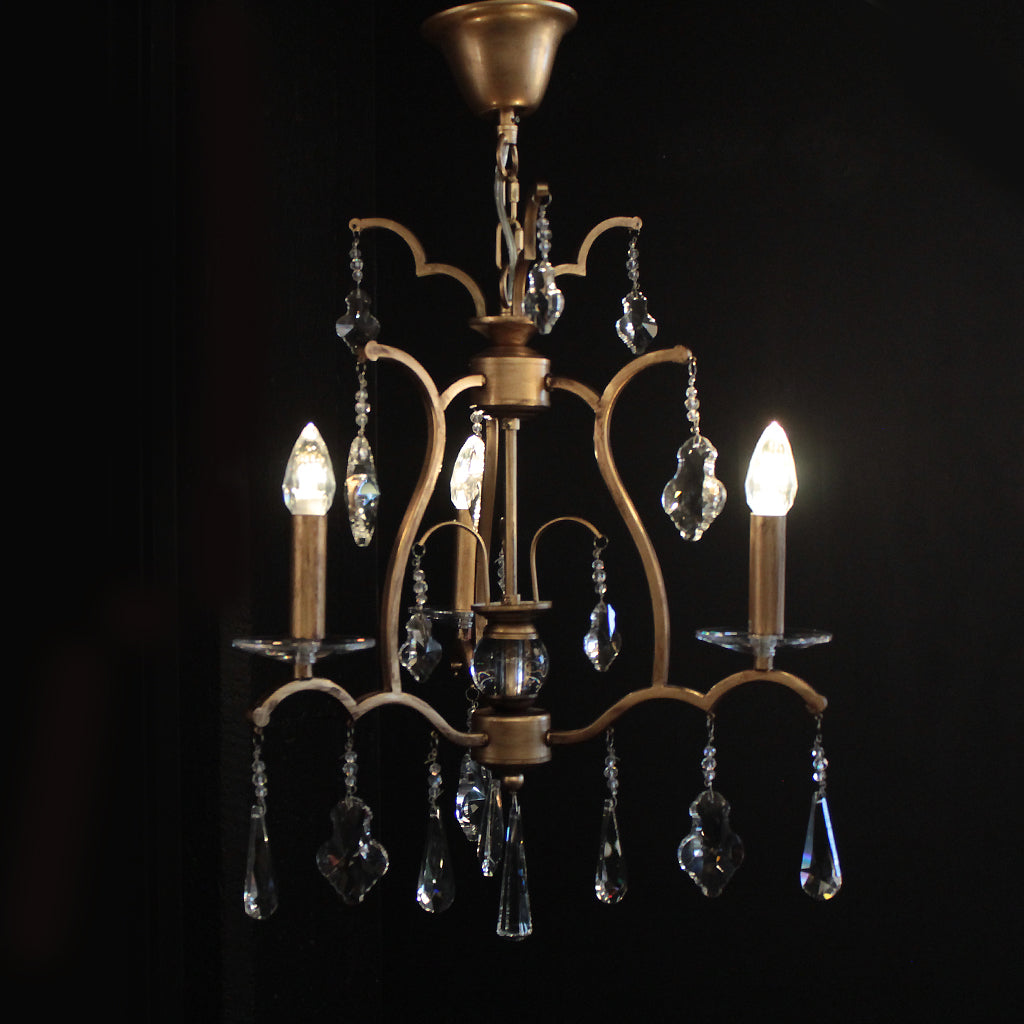 Decorative chandelier with crystal accents on a black background