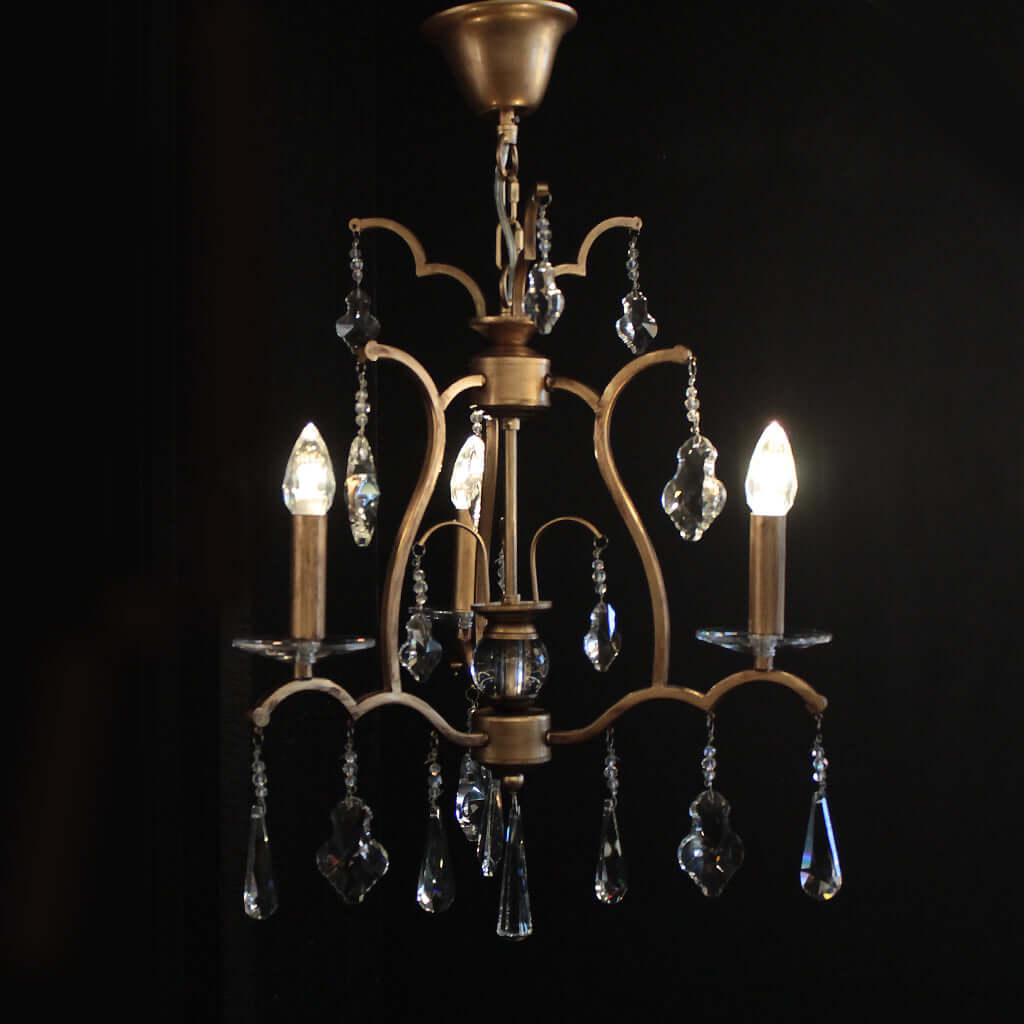 Decorative chandelier with crystal accents on a black background