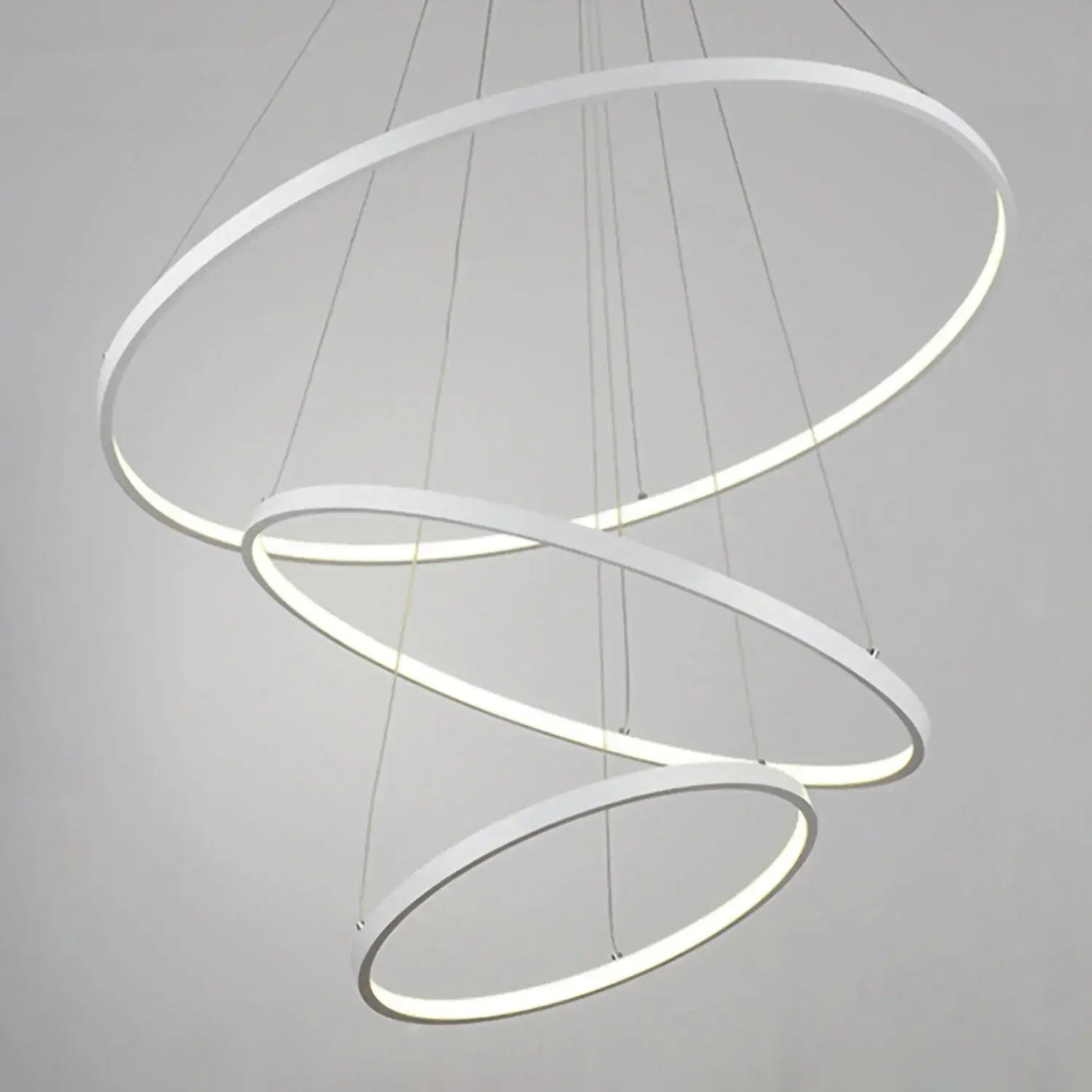Three white rings pendant on dark background