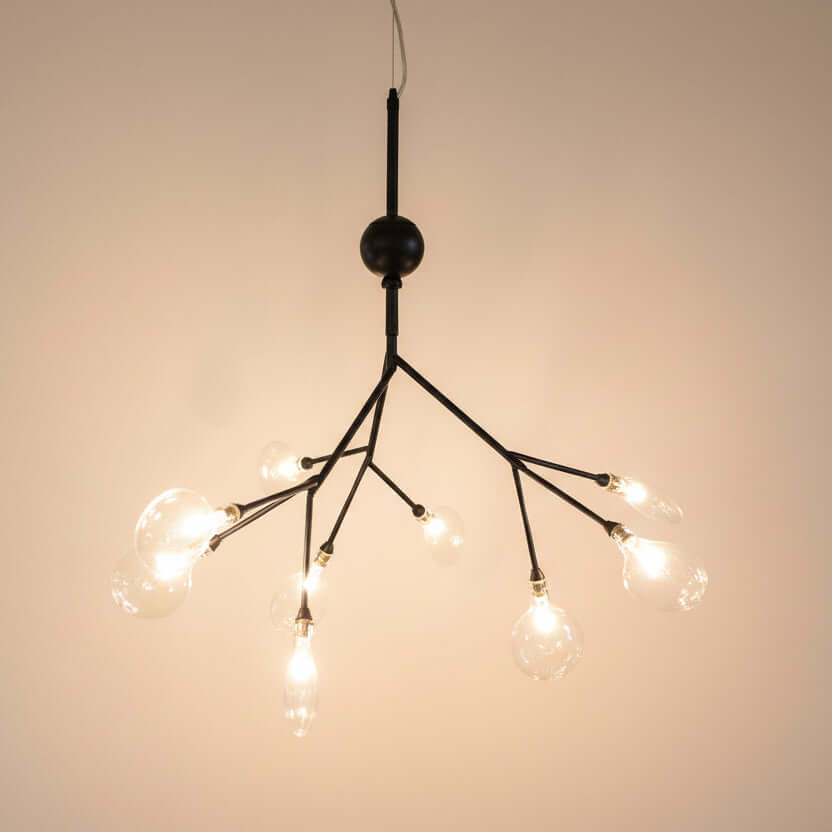 Modern chandelier with multiple light bulbs on a dark background