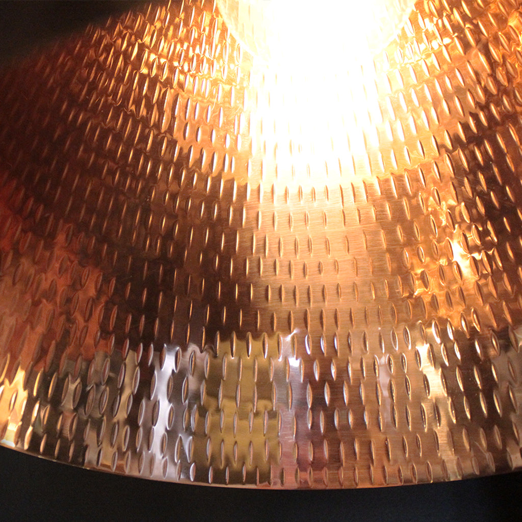 Close-up of a textured copper lampshade