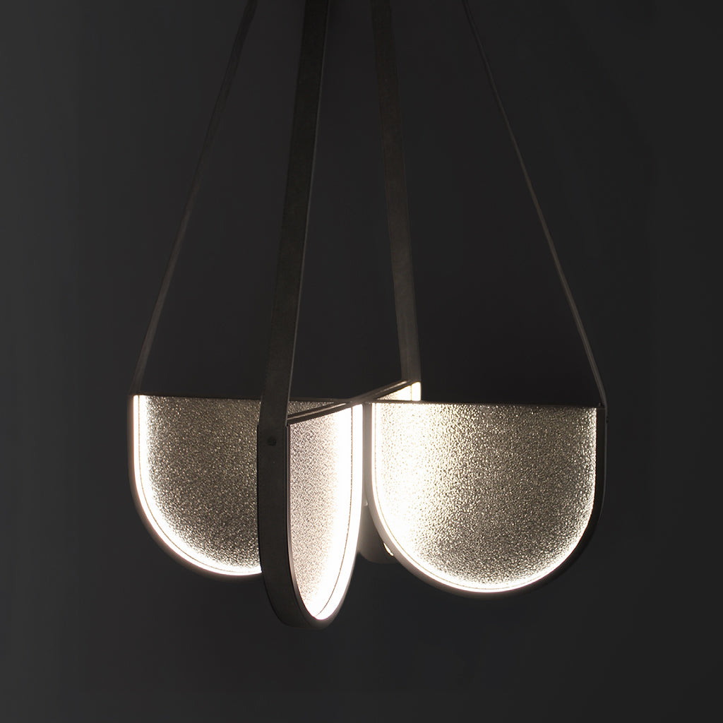 Modern pendant light with a handmade glass on a black background