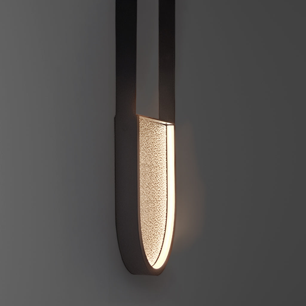 Modern pendant light fixture on a dark gray background