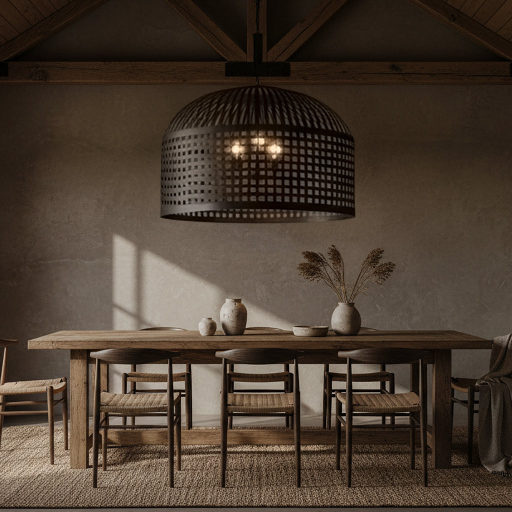 Dining room with wooden table and chairs under a large pendant light.