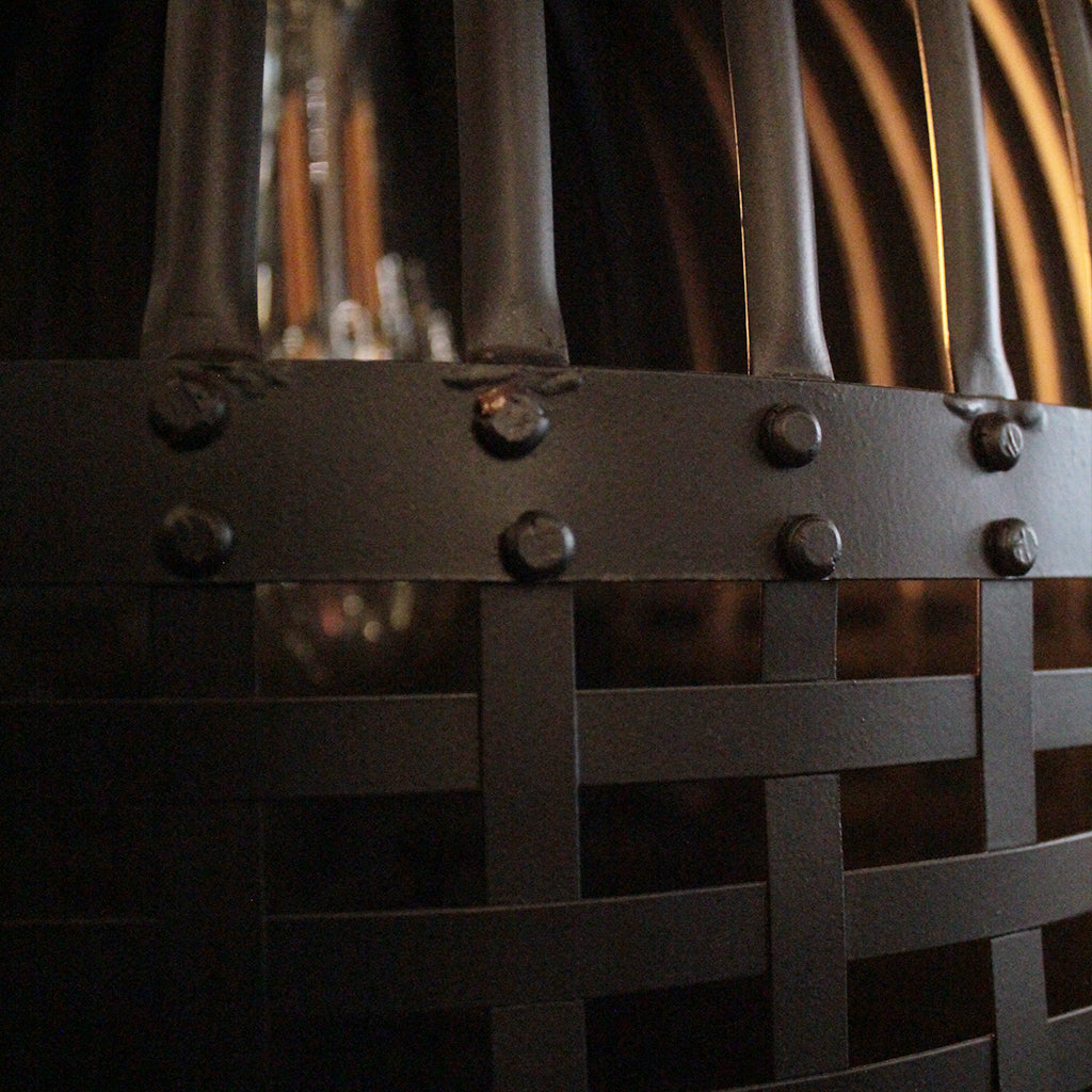 Close-up of a woven basket with metal rivets against a blurred background