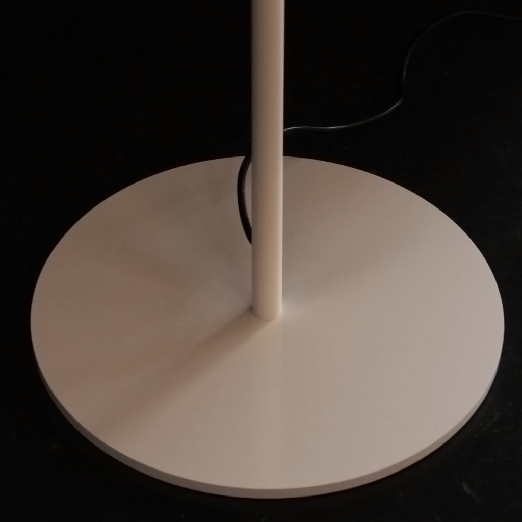 A simple white floor lamp base