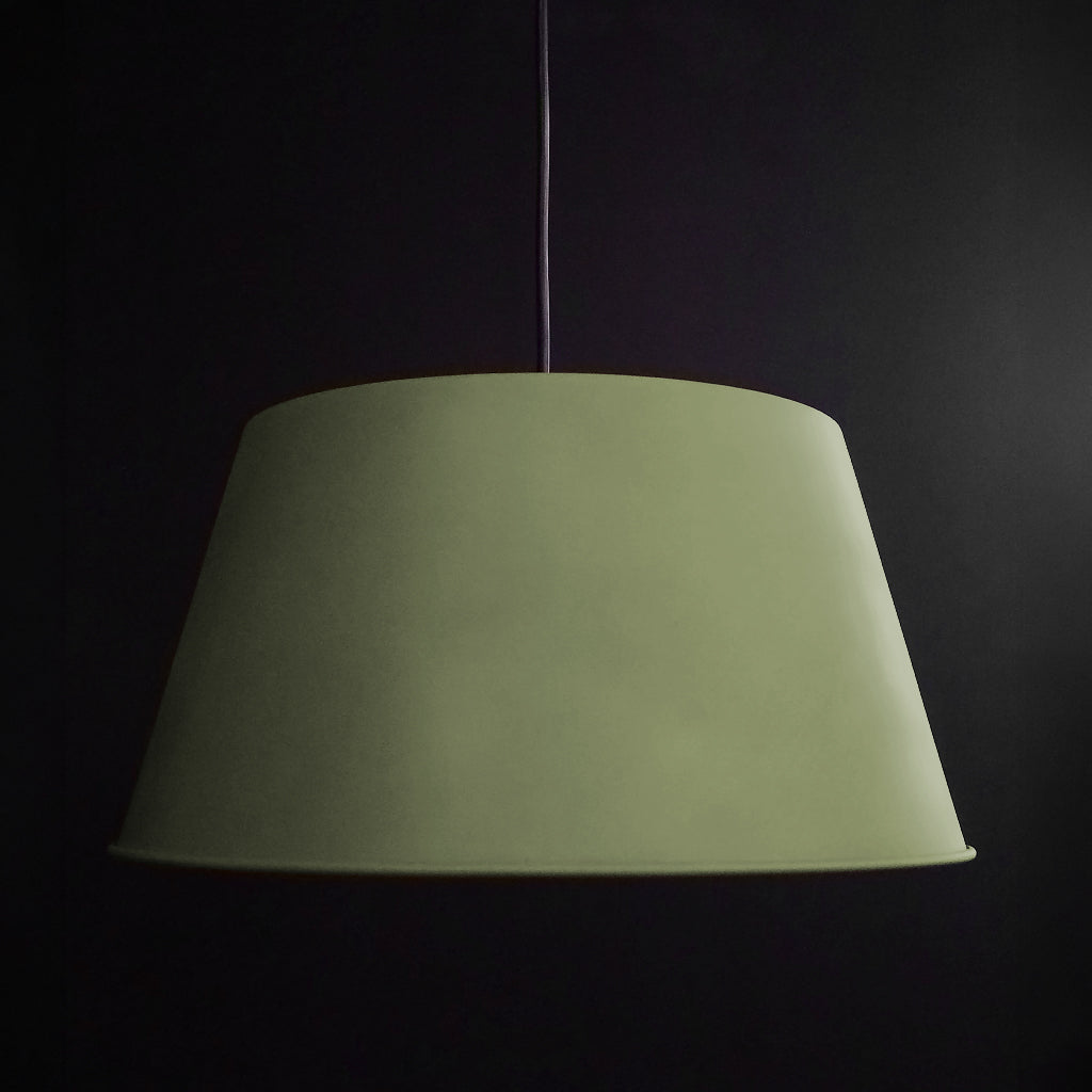 Green lampshade on a dark background